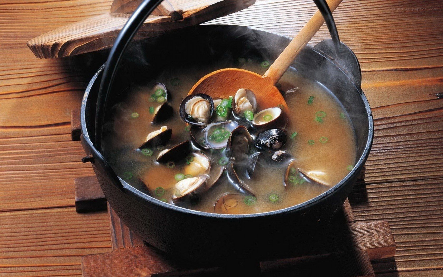 steaming clam soup in a pot