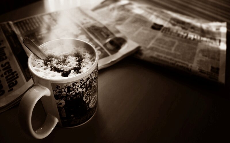 steaming coffee and newspaper