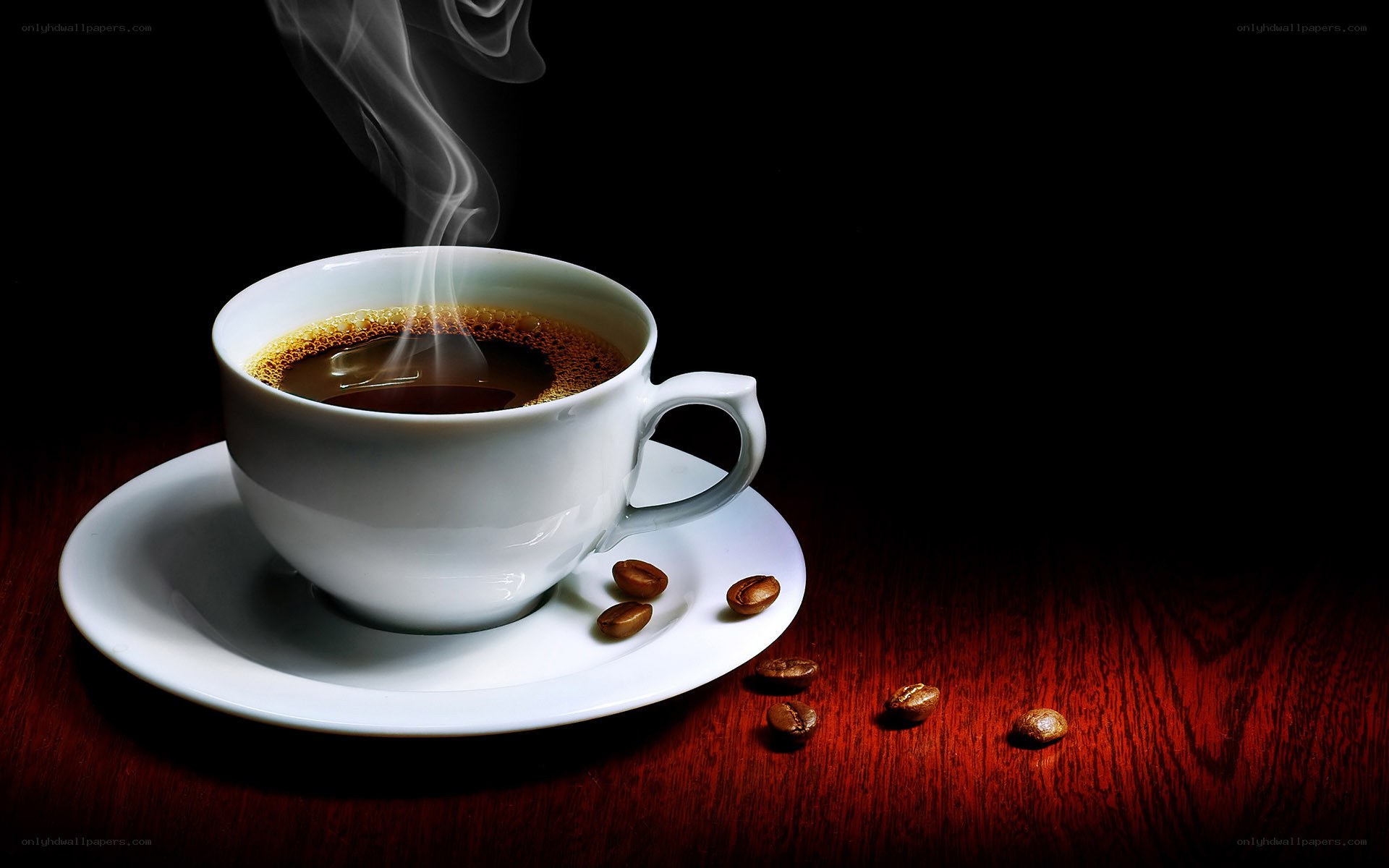 steaming coffee cup on wood
