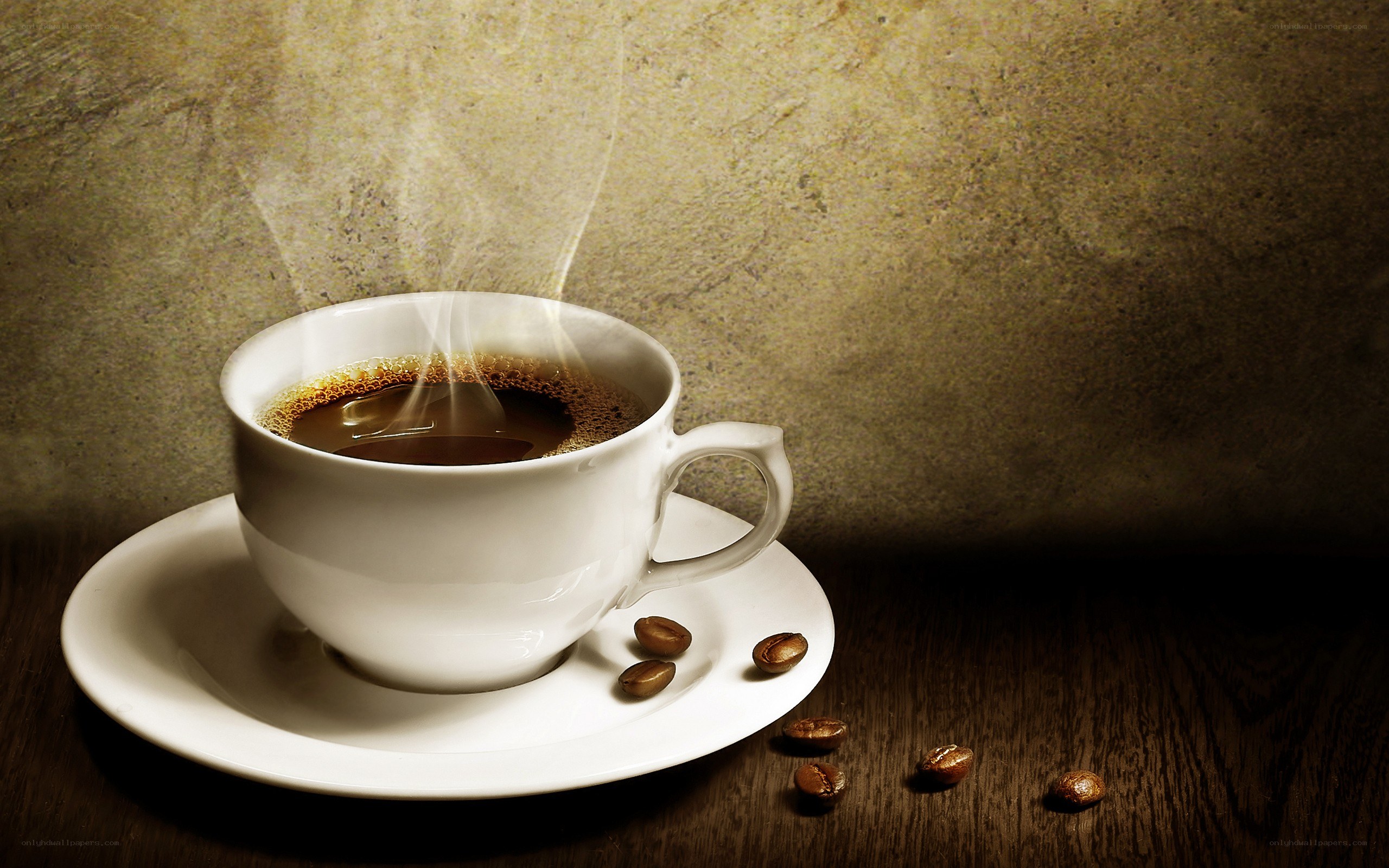 steaming coffee cup on wood