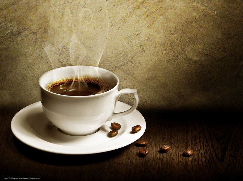 Steaming coffee cup on wood