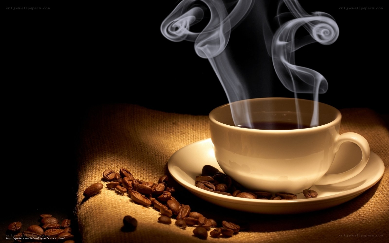 steaming coffee cup with beans