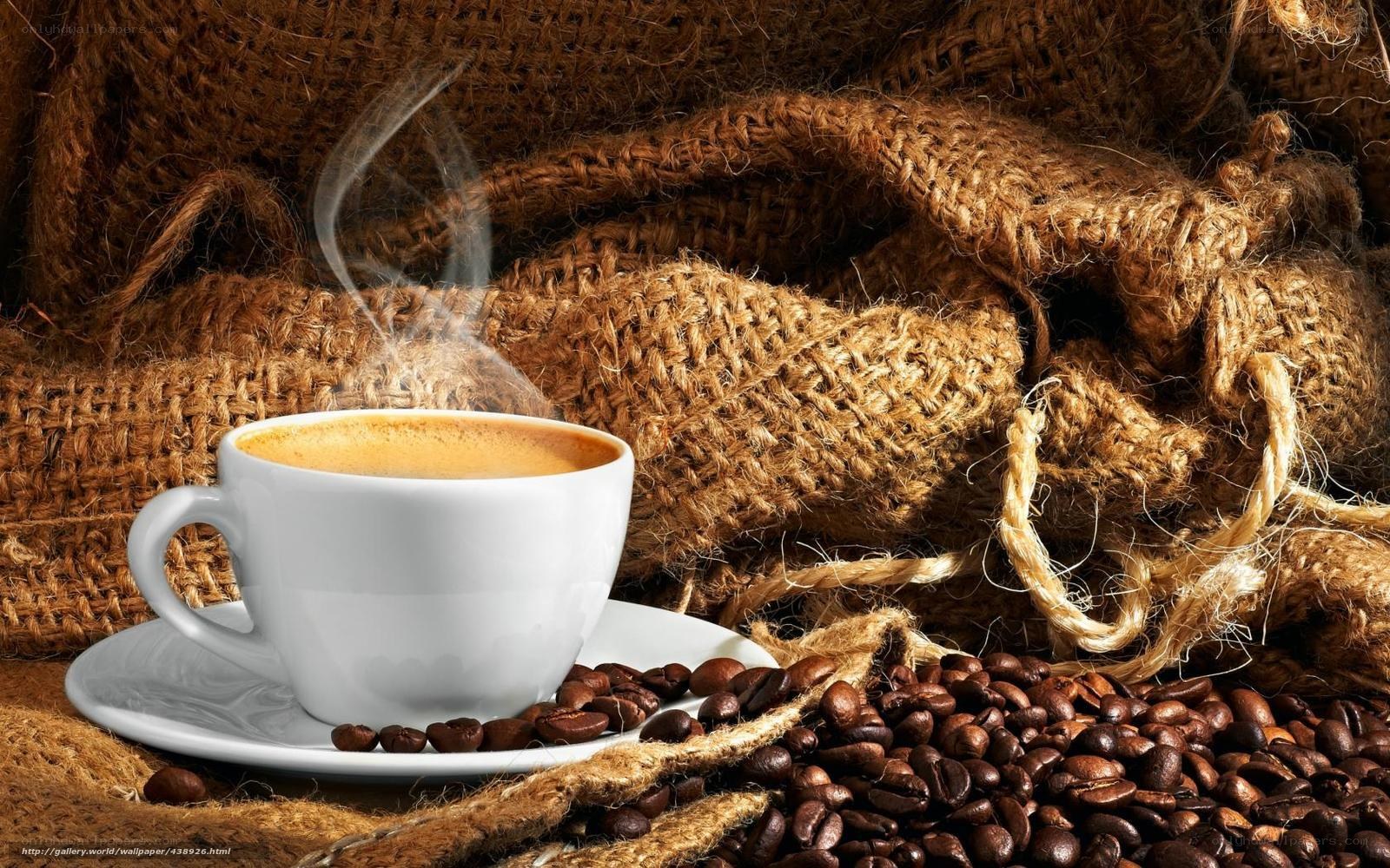 steaming coffee cup with beans
