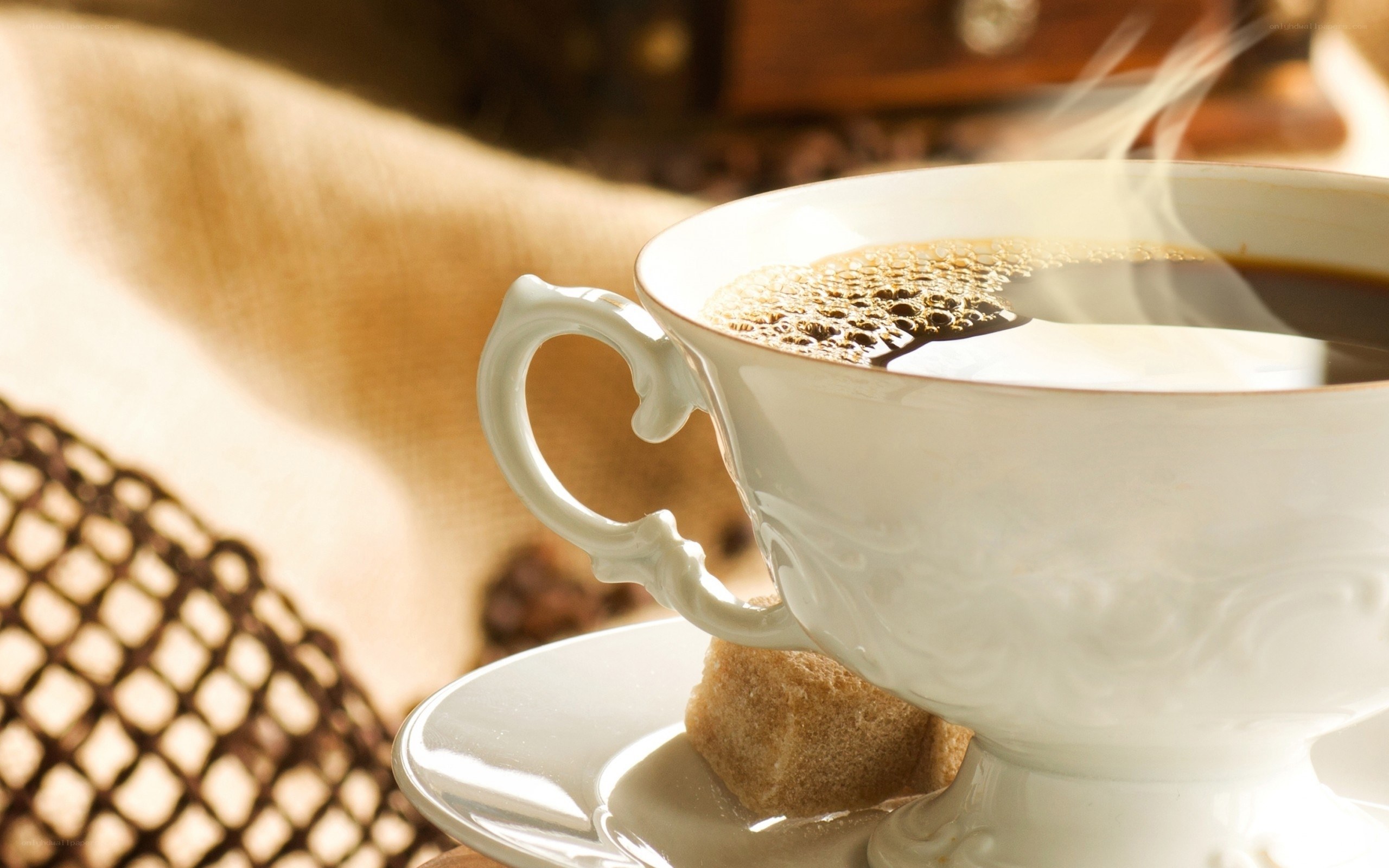 steaming coffee cup with sugar