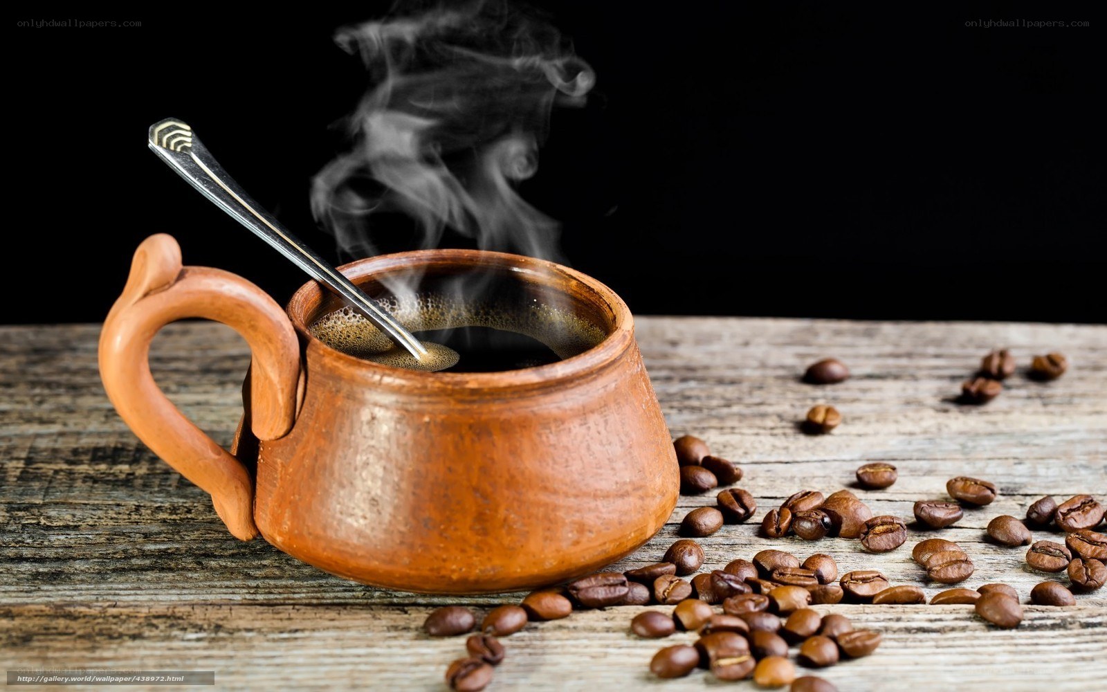steaming coffee in clay mug