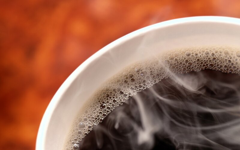 Steaming Coffee in Cup — Brown