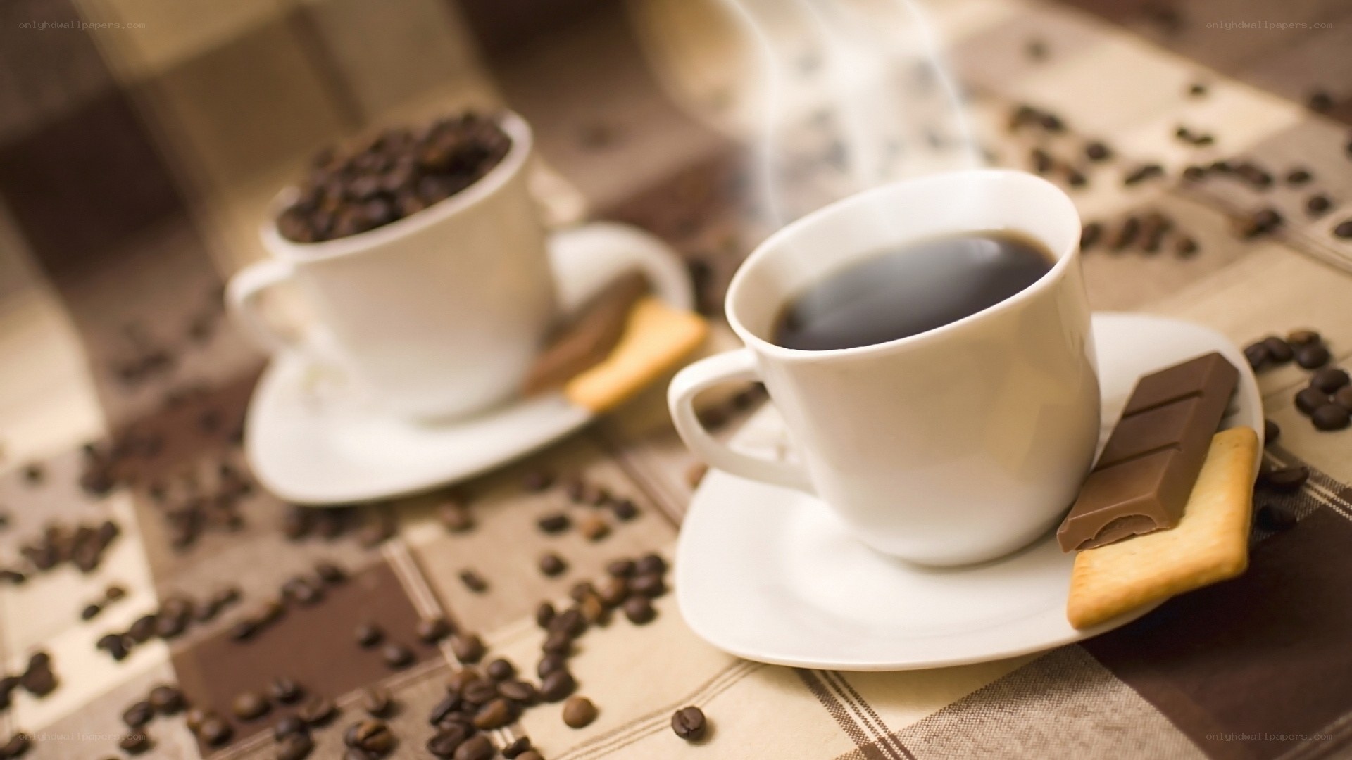 Steaming coffee with chocolate and cookies