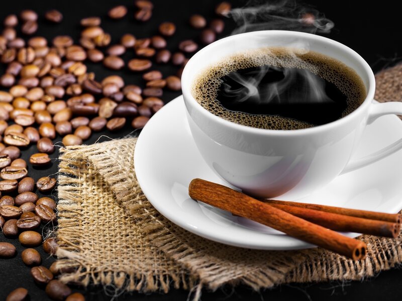 steaming coffee with cinnamon