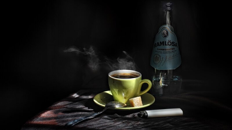 Steaming coffee with mineral water