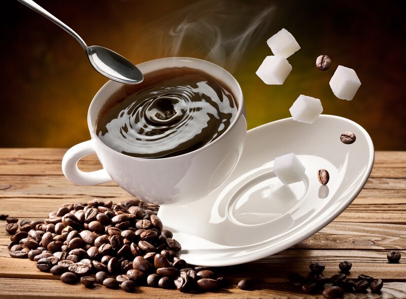 steaming coffee with sugar cubes