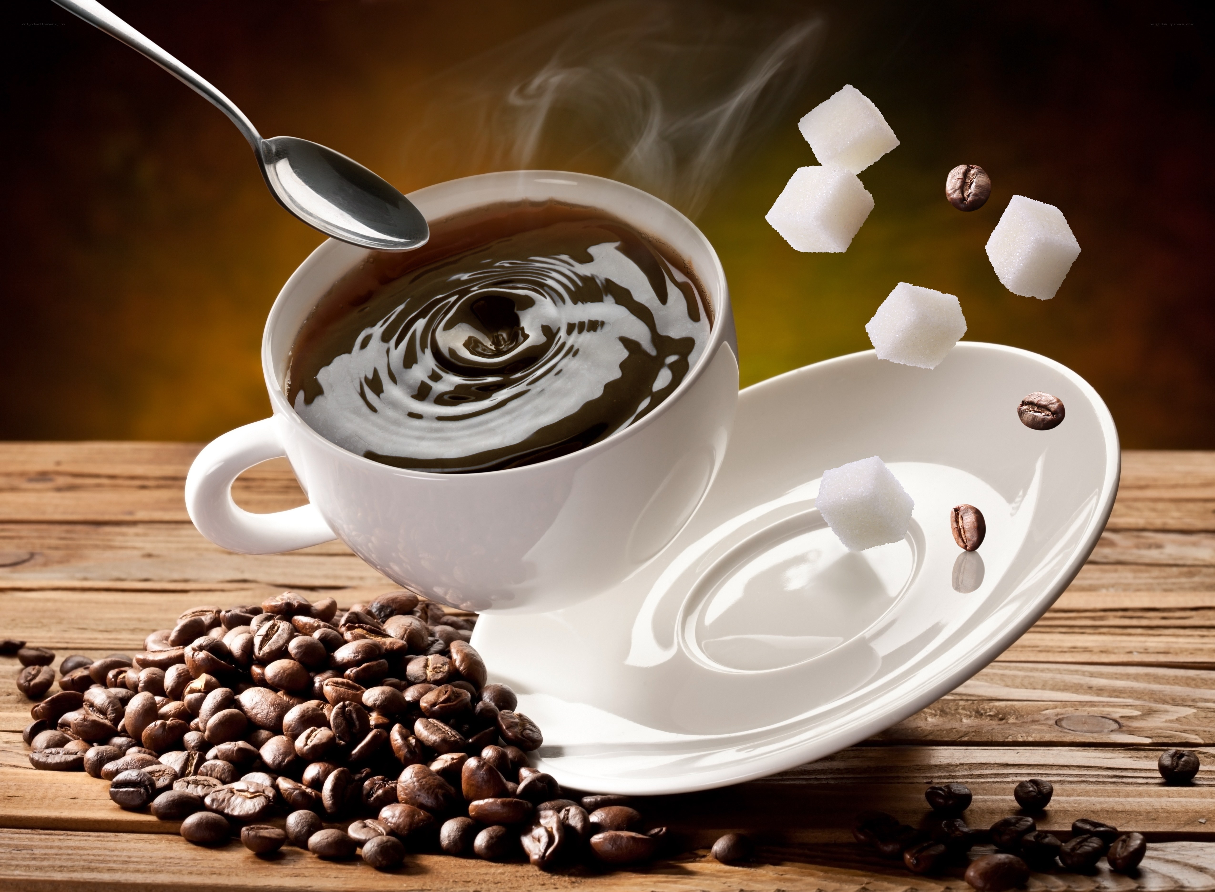 steaming coffee with sugar cubes