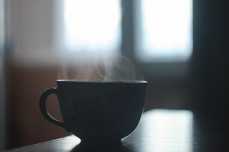 steaming cup by window