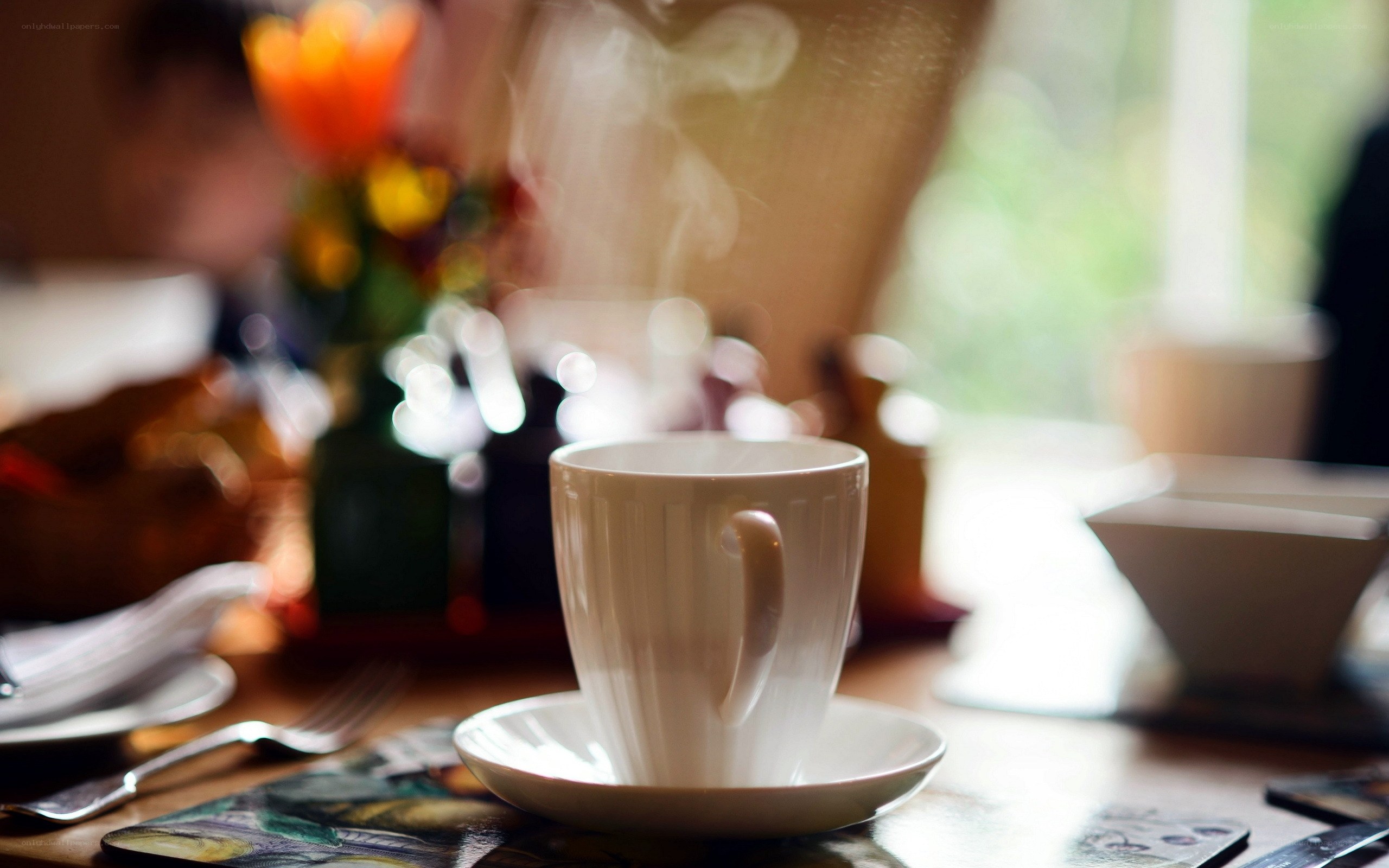 steaming cup of tea on table