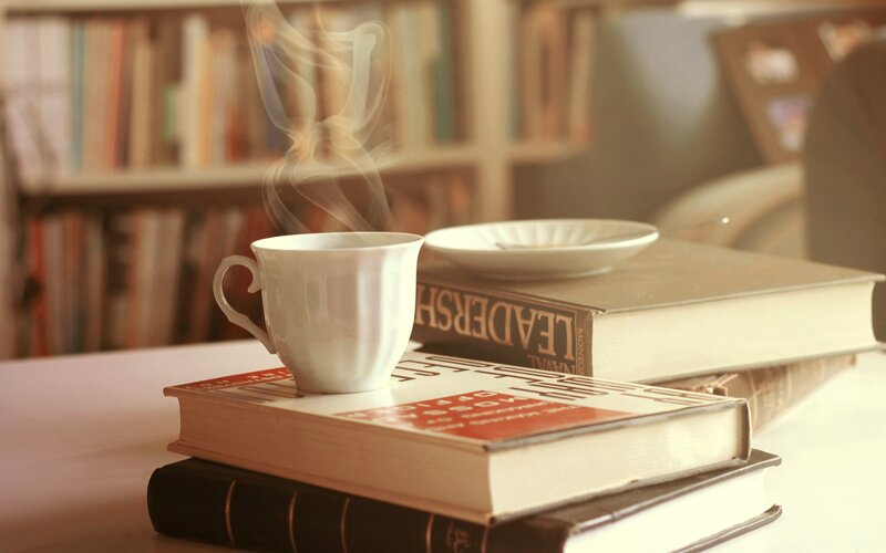 Steaming Cup on Books
