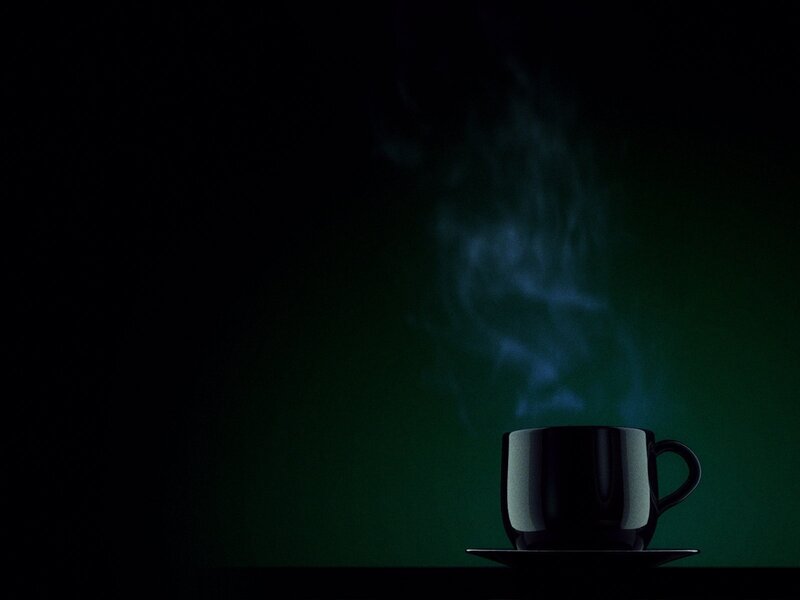 steaming cup on dark background