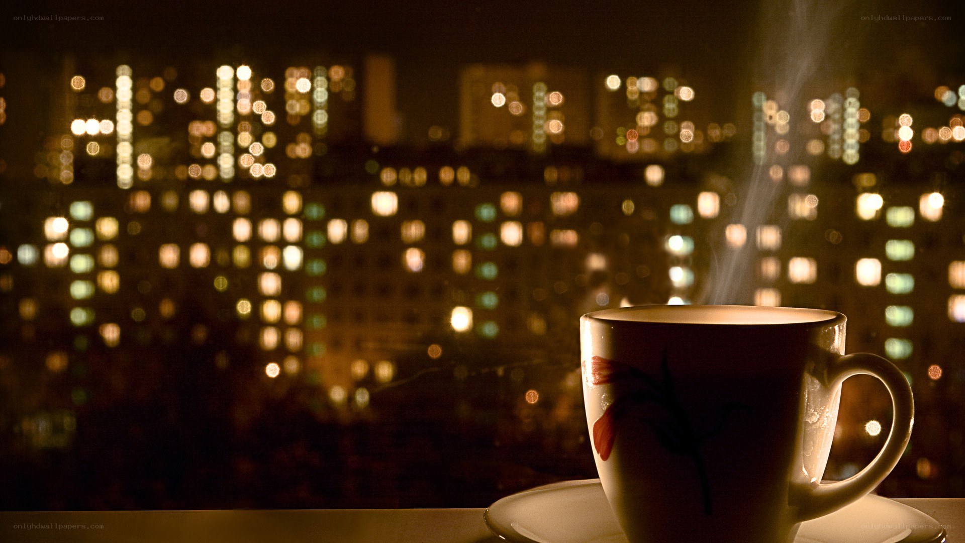 steaming cup with city lights