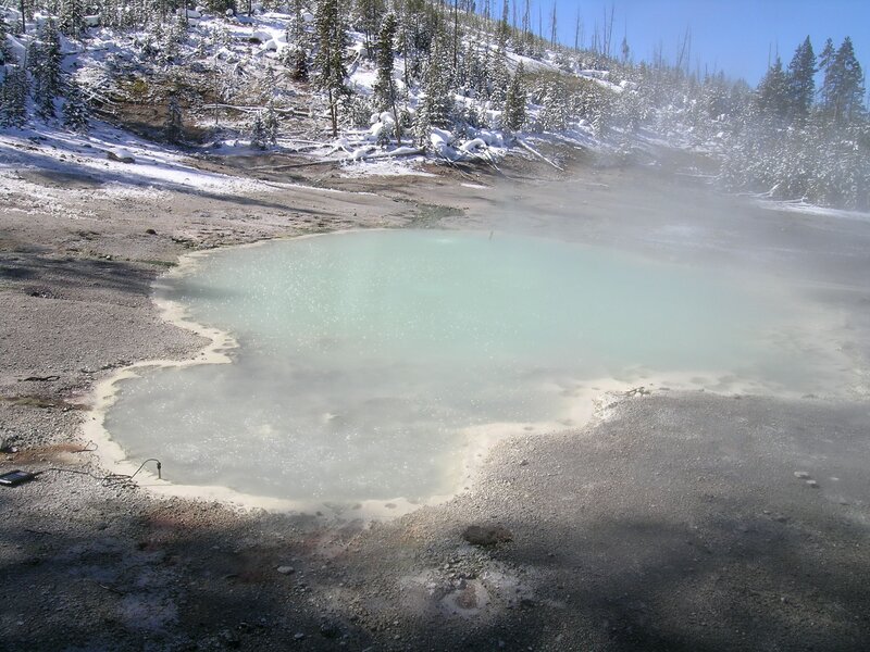 steaming geothermal pool in winter