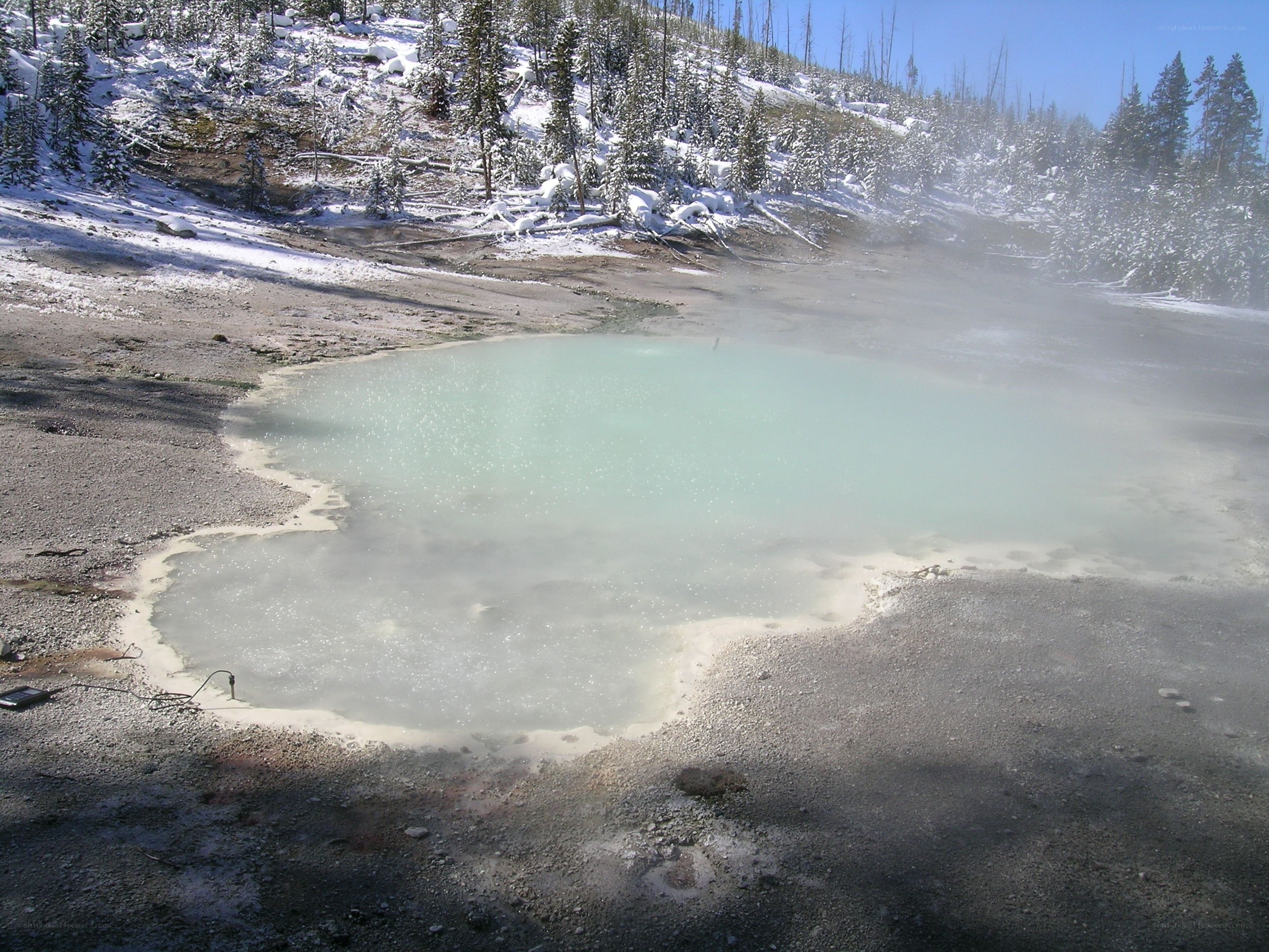 steaming geothermal pool in winter