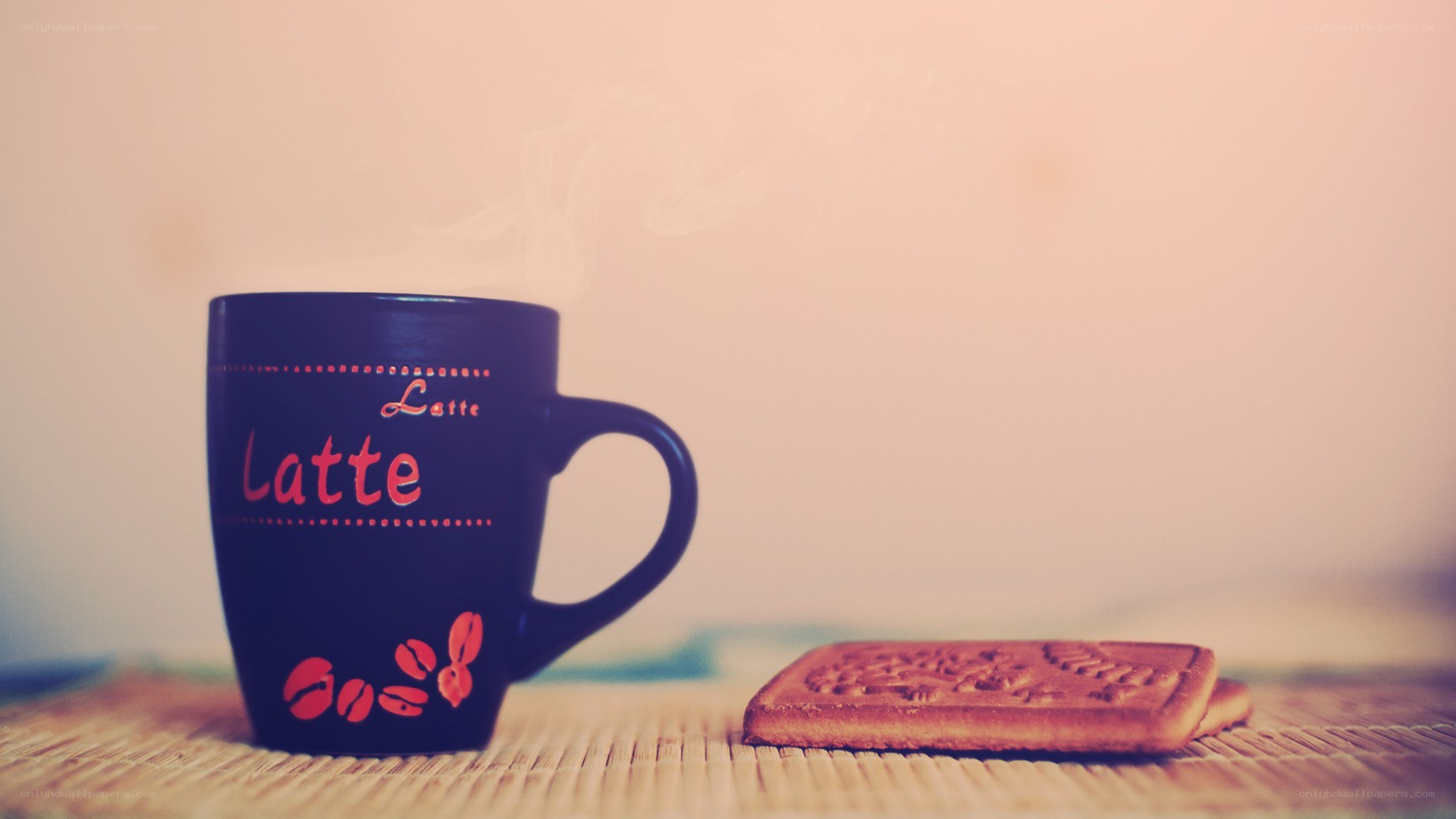 Steaming latte with cookies