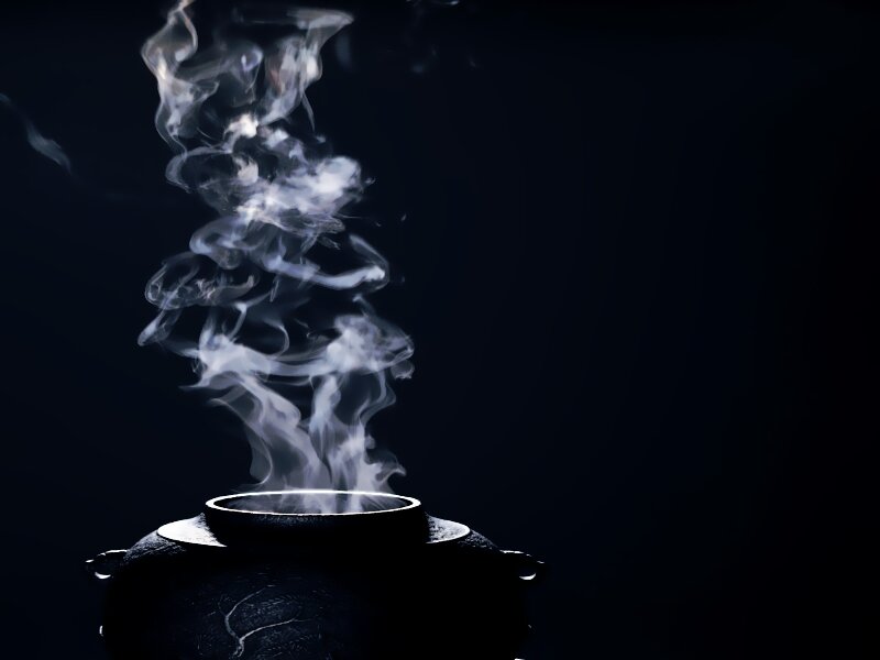 Steaming Pot on Dark Background