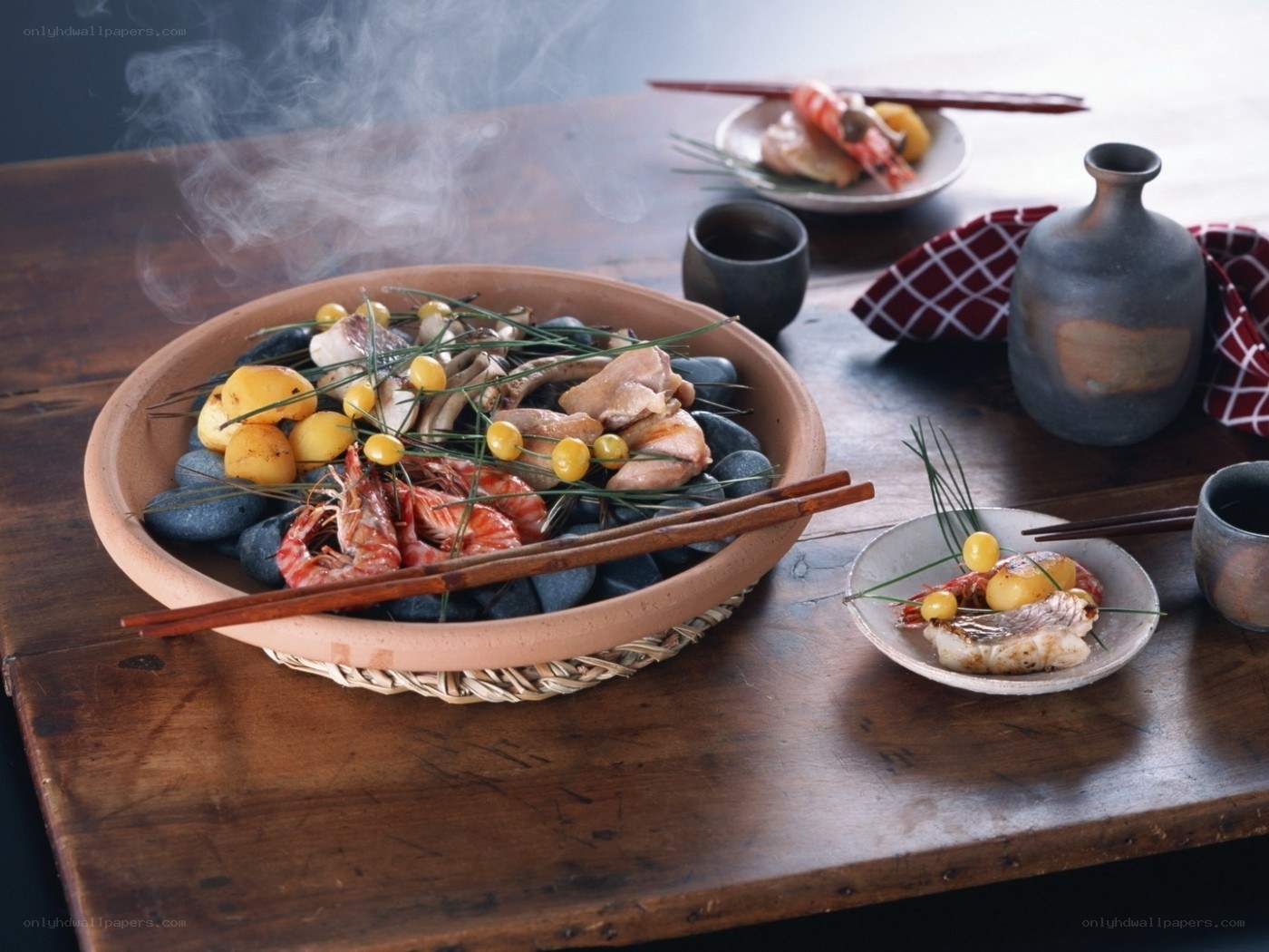 Steaming seafood dish on hot stones