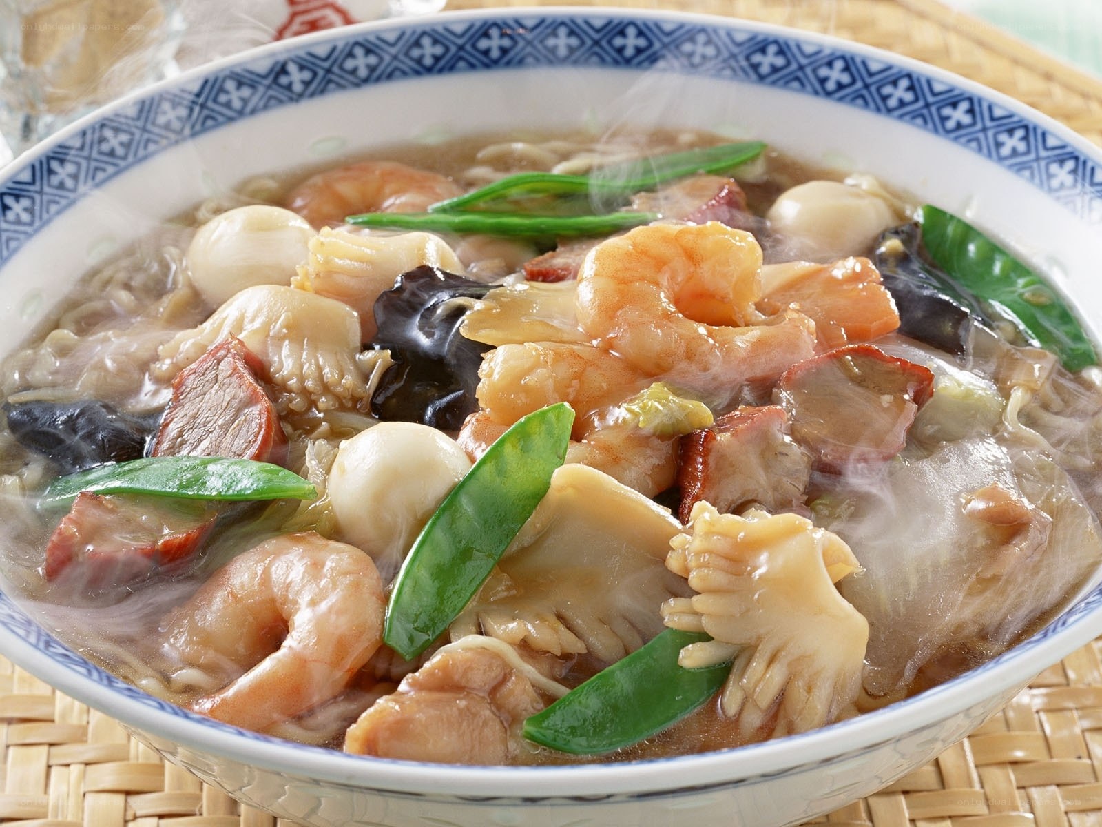 steaming seafood noodle soup
