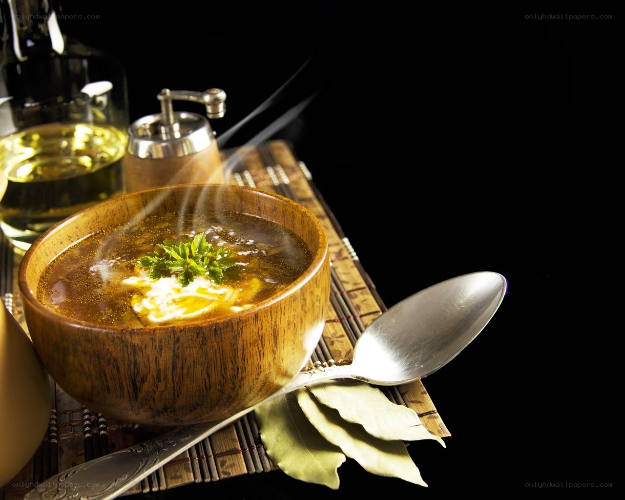 Steaming soup in wooden bowl