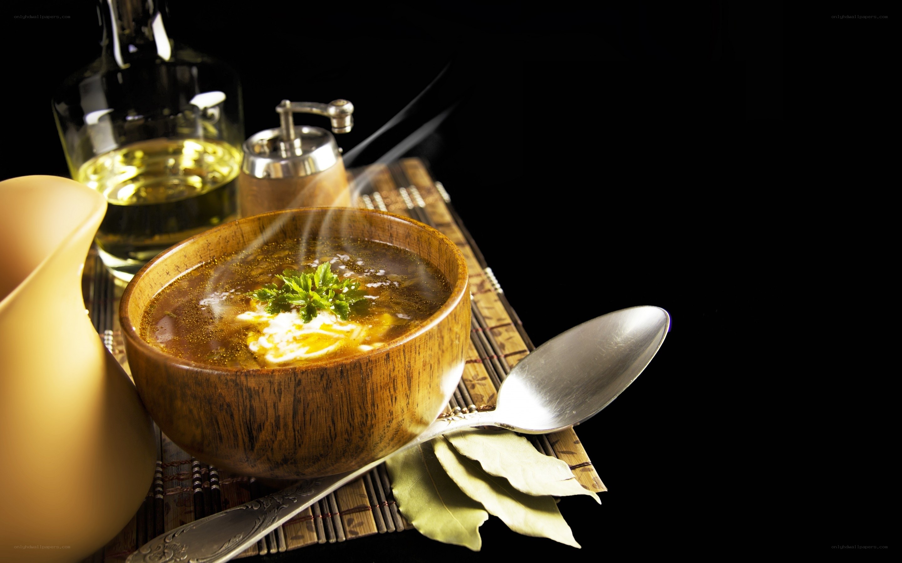 Steaming soup with herbs