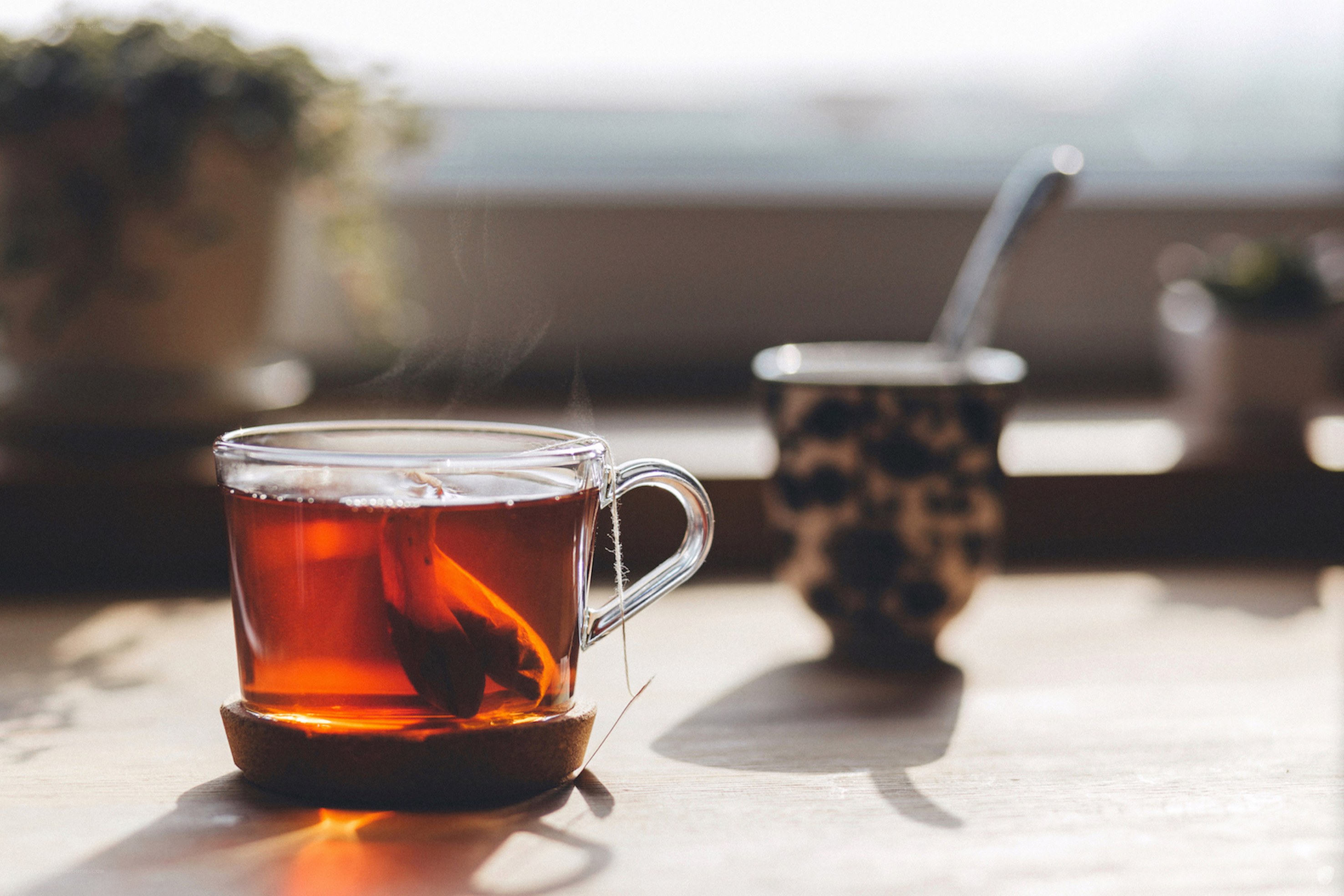 steaming tea in a glass cup