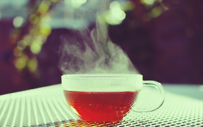 Steaming Tea in Glass Cup — Red