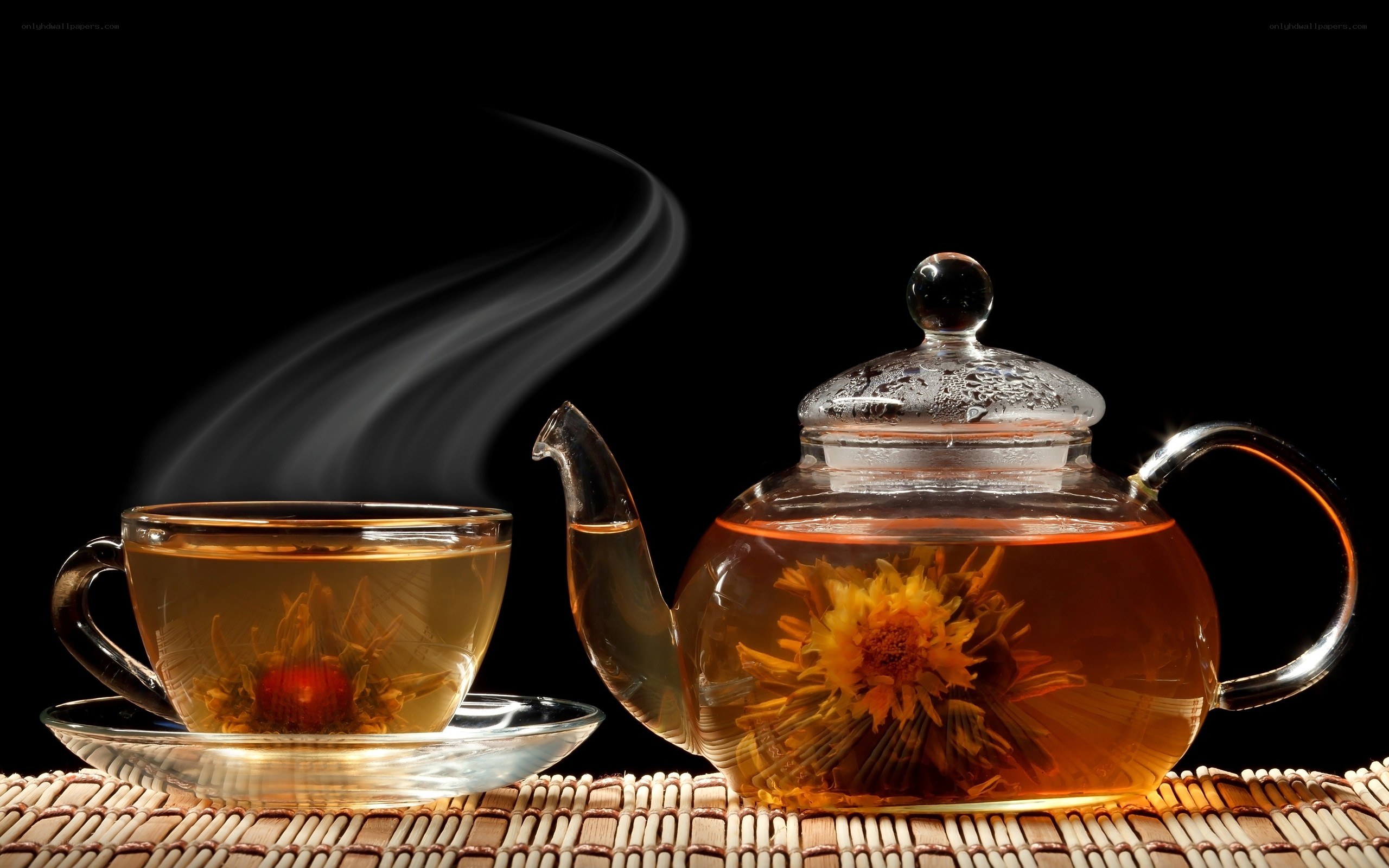 Steaming tea with blooming flower