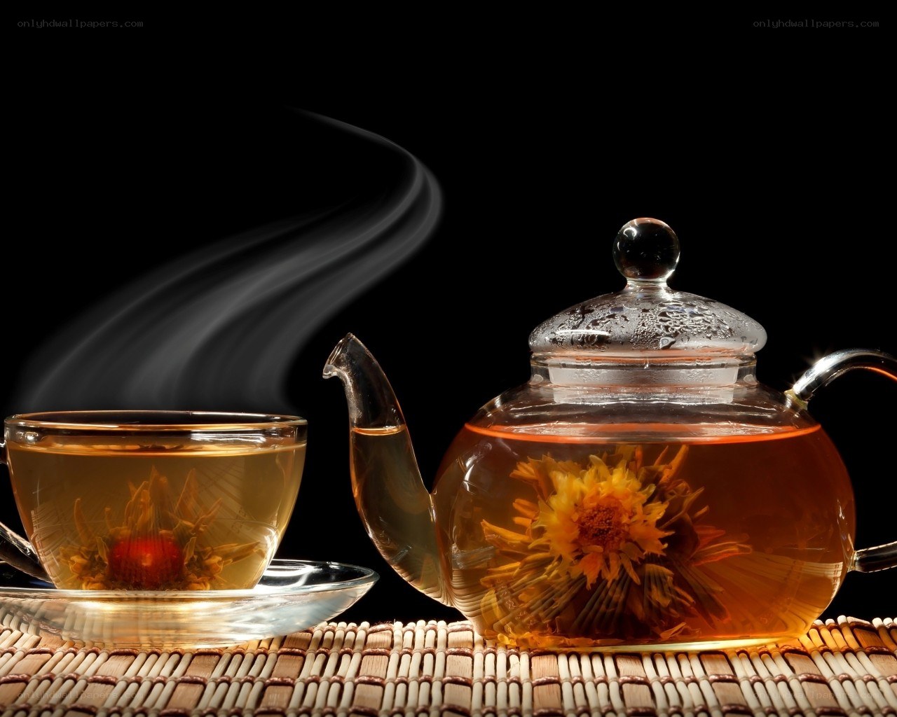 Steaming tea with blooming flower