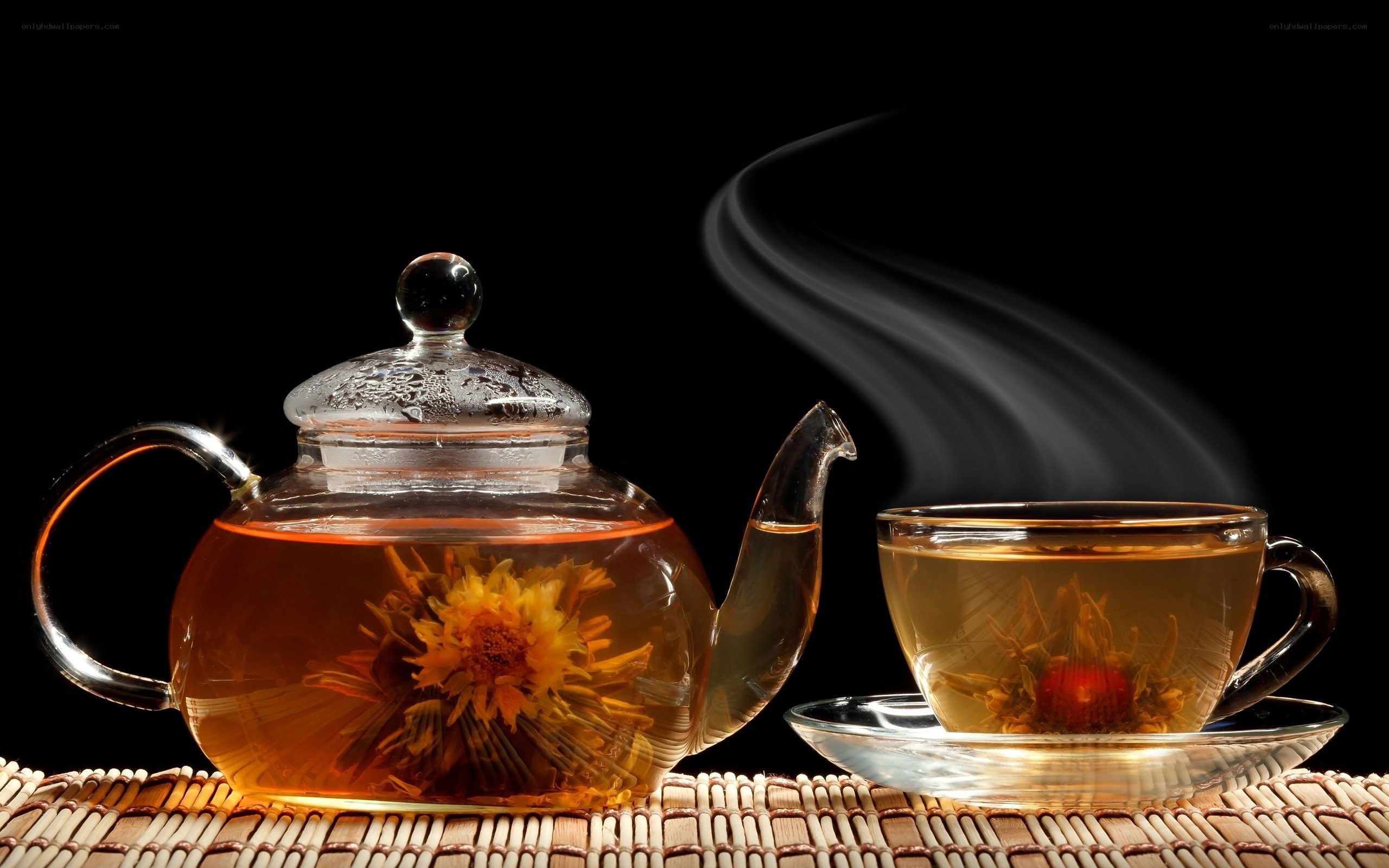 Steaming tea with blooming flower