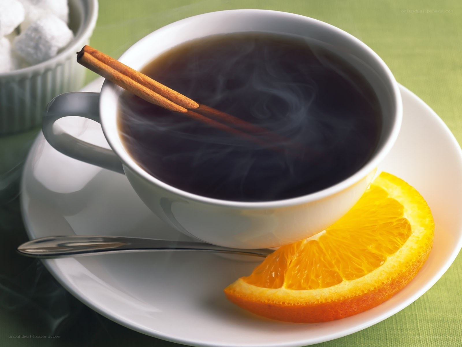 Steaming tea with cinnamon and orange
