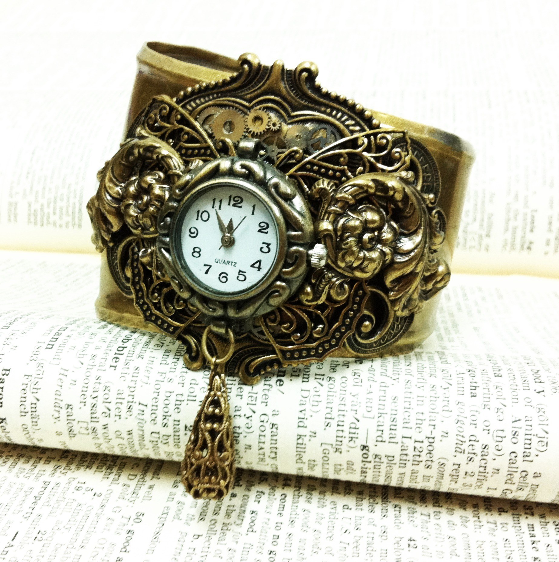 steampunk watch on book