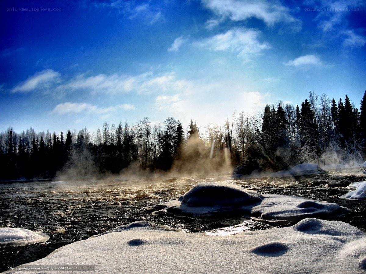 Steamy river in winter landscape