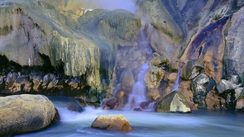 Steamy waterfall in a rocky canyon