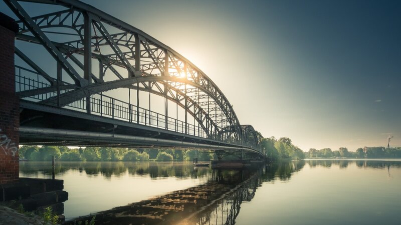 Steel Arch Bridge — Blue, Serene, Sunset