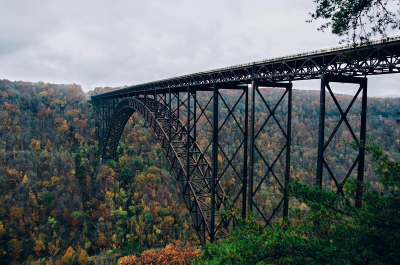 Steel Arch Bridge — Green, Dramatic, Autumn