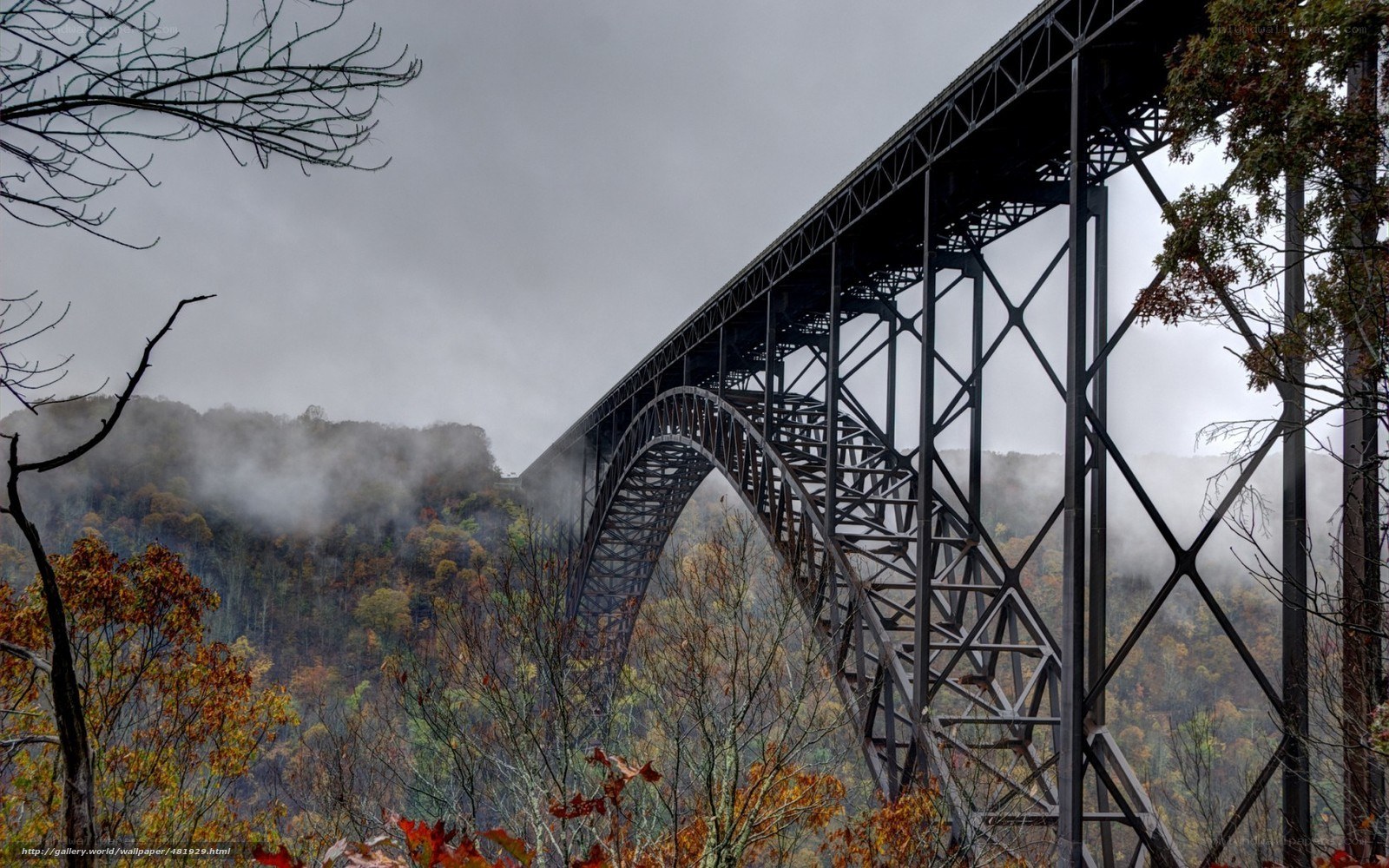 Steel arch bridge in autumn mist