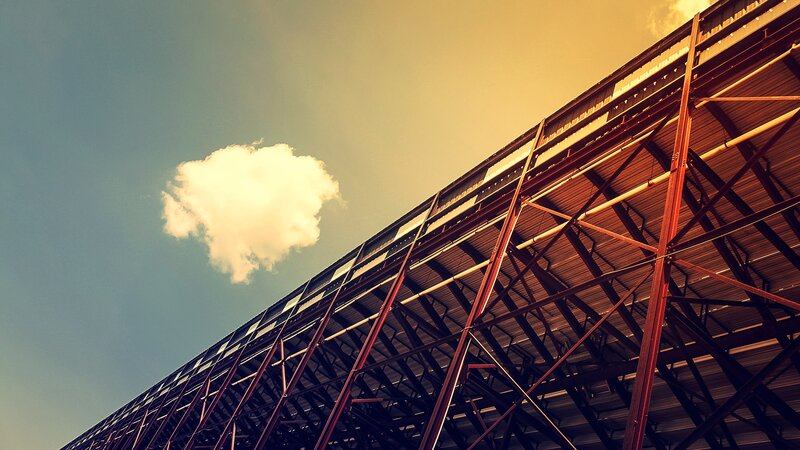 Steel structure under cloudy sky
