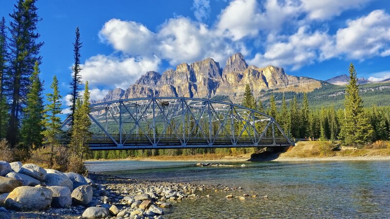 Steel Truss Bridge — Blue, Serene, Afternoon, Photograph, River, Mountains