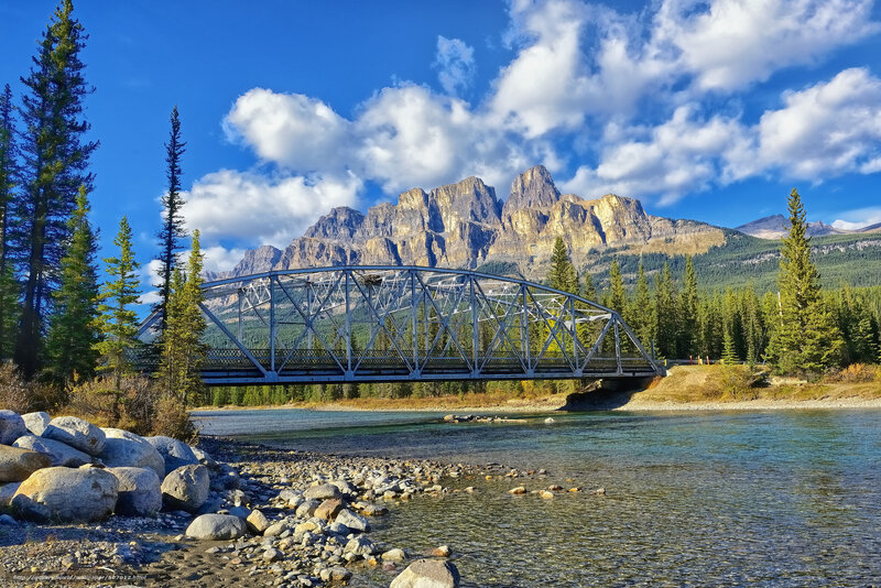 Steel Truss Bridge — Blue, Serene, Afternoon, Photograph, River, Mountains, Trees