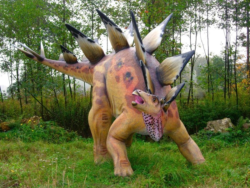 Stegosaurus statue in forest