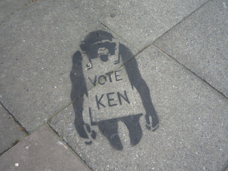 stencil art of monkey on pavement