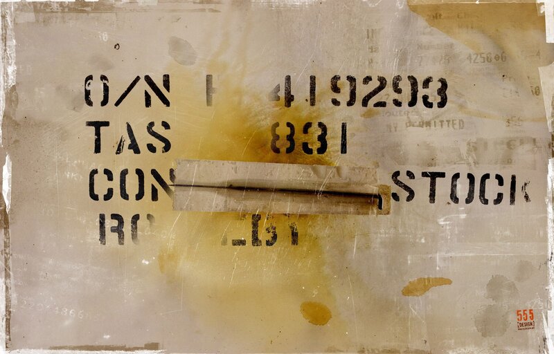 stenciled label on weathered surface