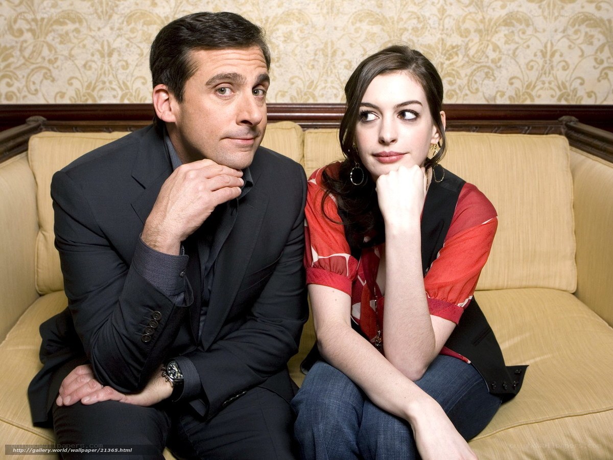 Steve Carell and Anne Hathaway on a couch