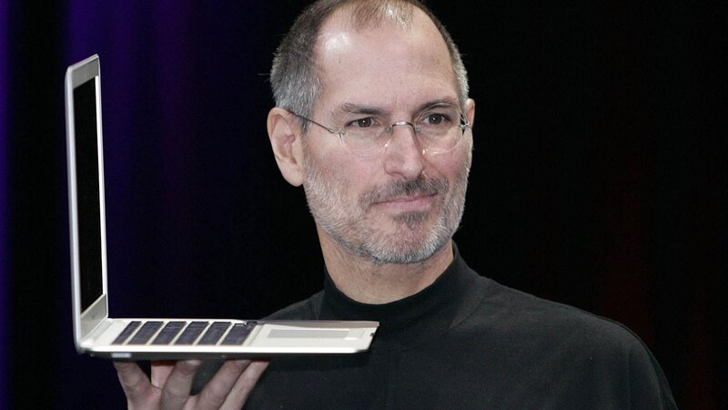 Steve Jobs Holding Laptop — Black, Dramatic