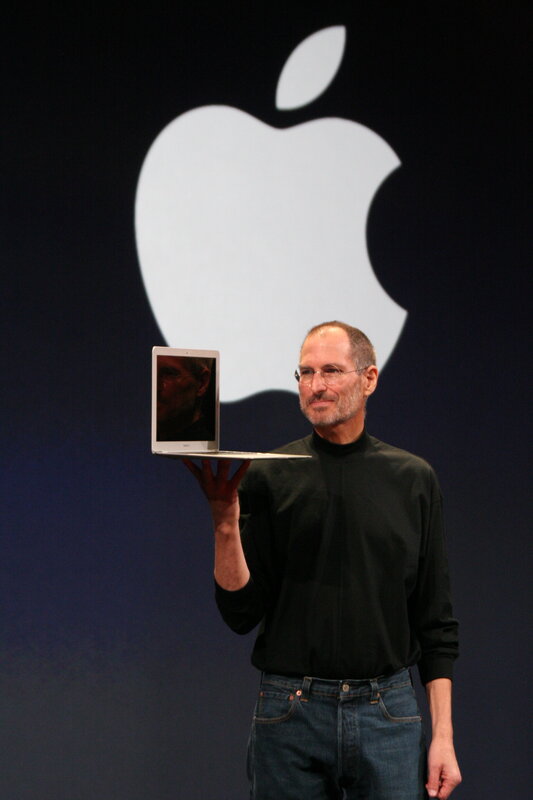 Steve Jobs presenting a laptop