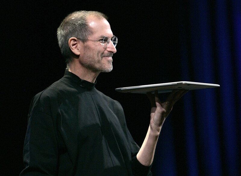 Steve Jobs presenting a laptop